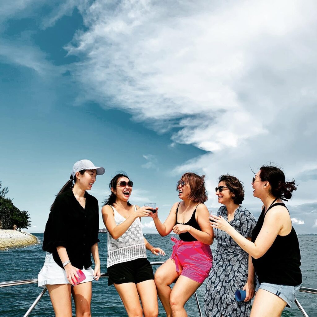 Friends raising a toast on a Sea Friends yacht party