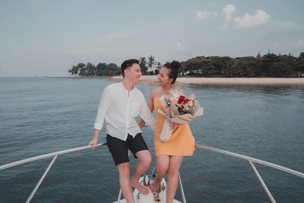 Couple with flowers on the bow of a Sea Friends yacht