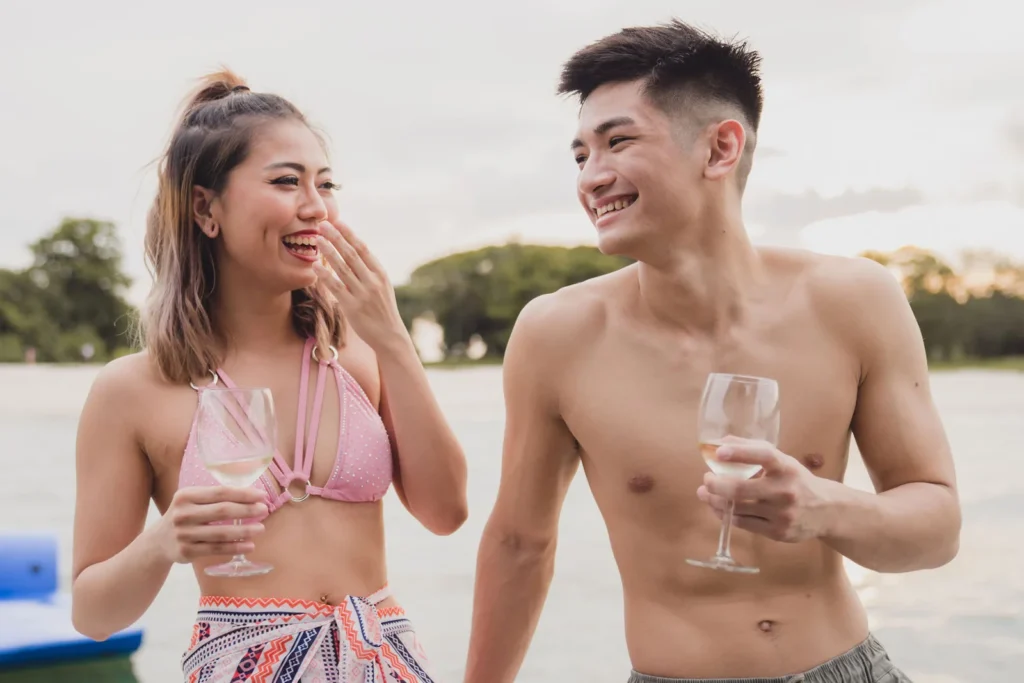Couple sharing wine on a Sea Friends sunset cruise